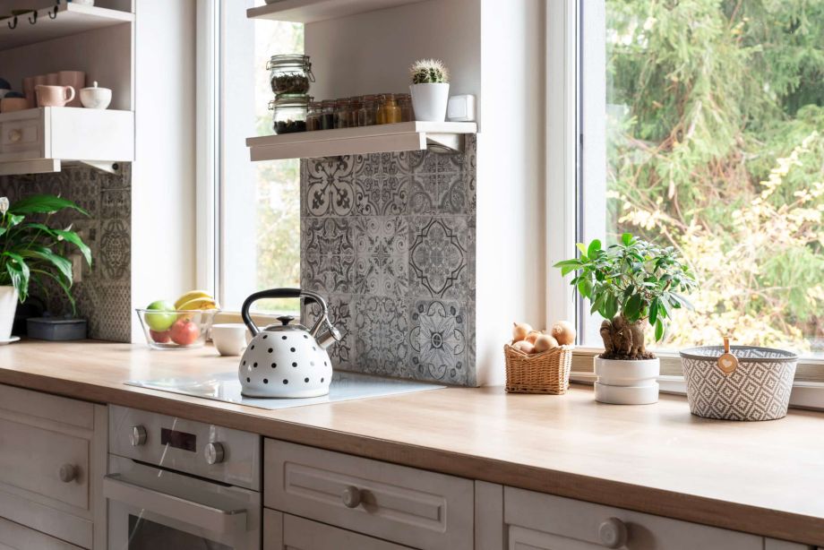 Cosy, eclectic kitchen with white uVPC windows