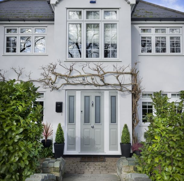 Traditional white door opening onto neutral interior