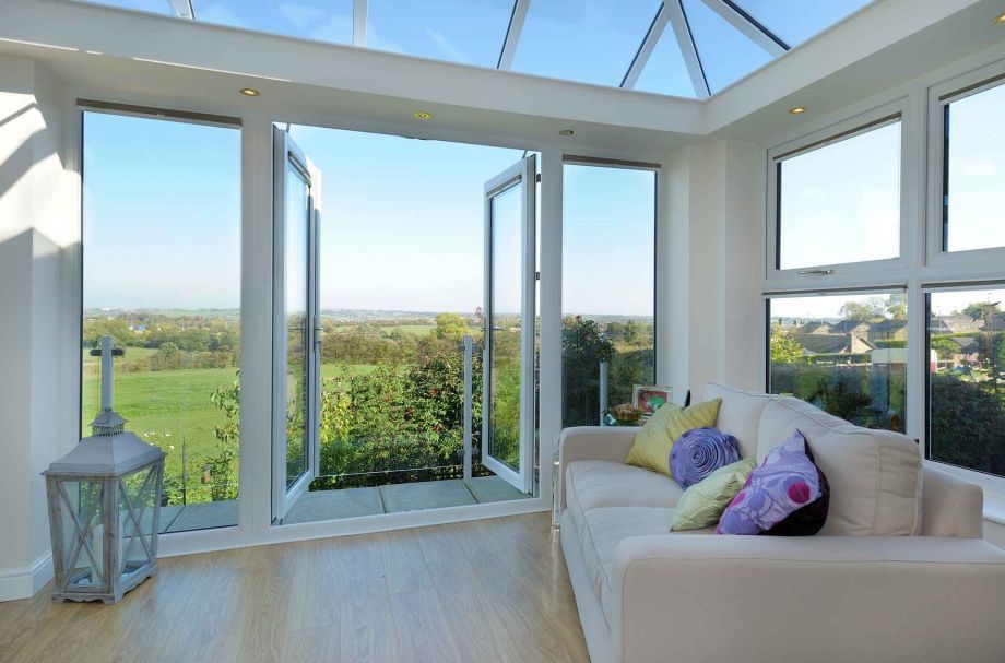 Glass conservatory with open doors	