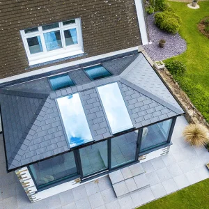 Guardian Warm Roof conservatory in sweeping garden