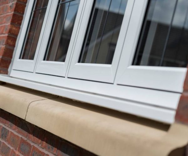 close-up of uPVC window frames in a red-brick house