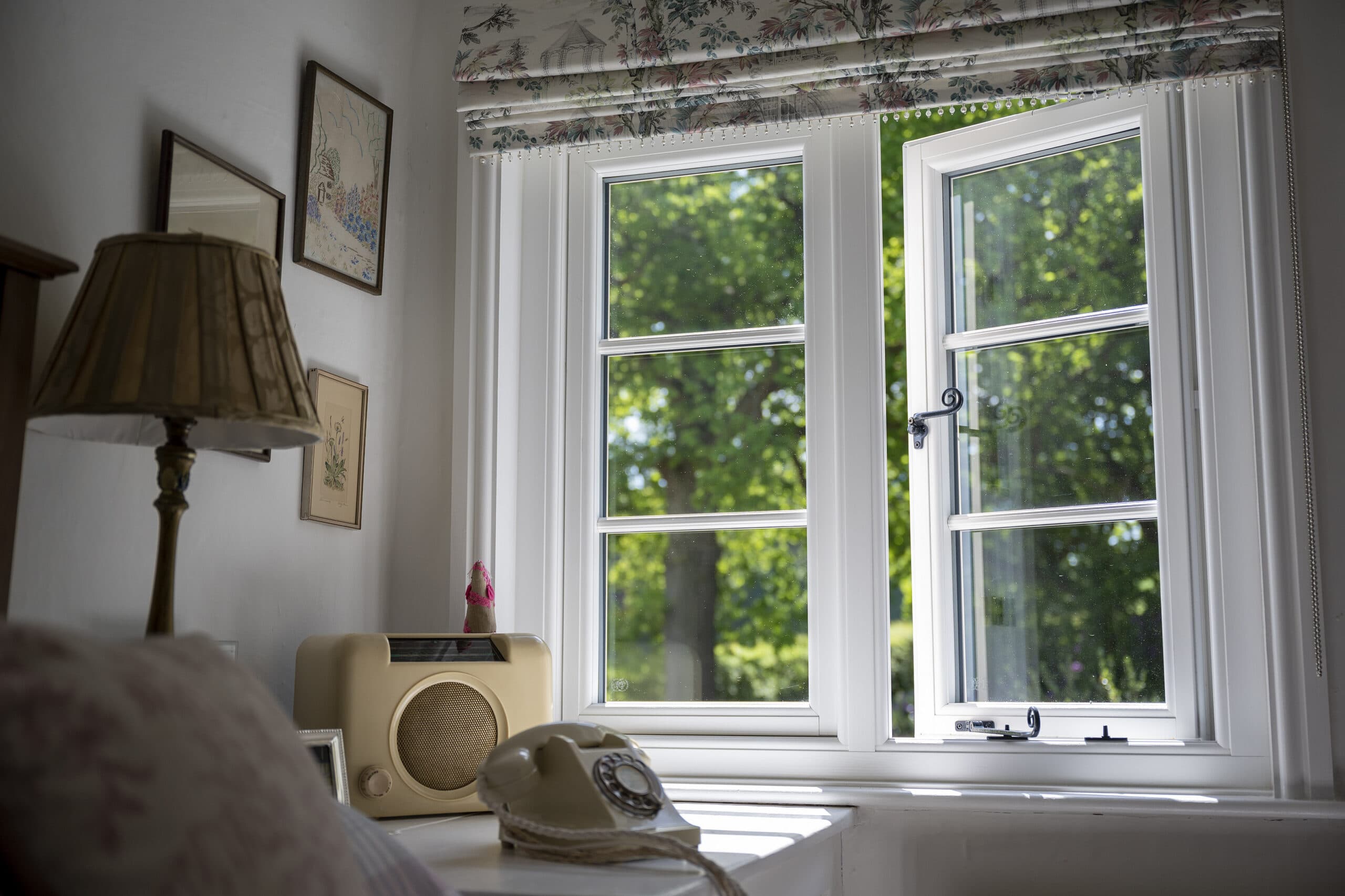 Beautiful white period window in vintage bedroom