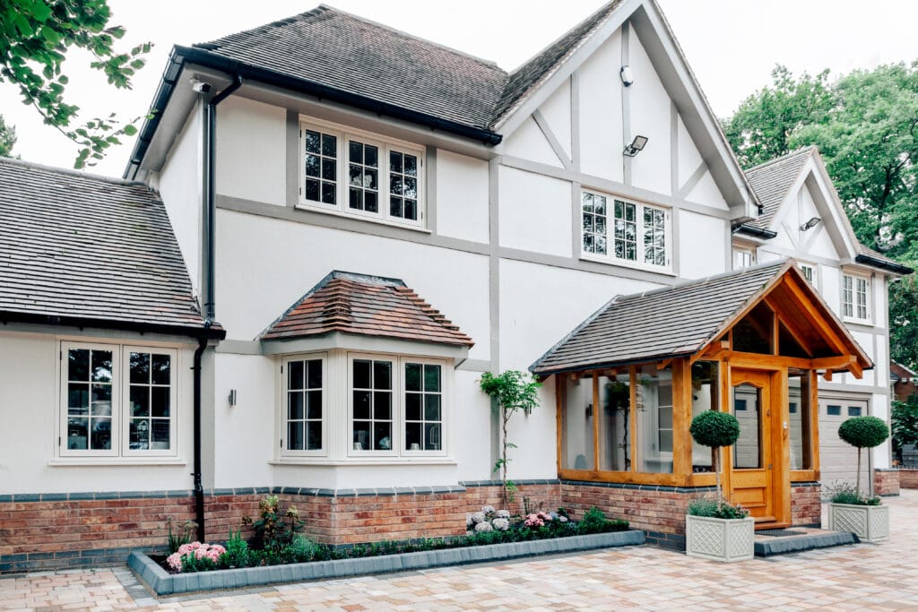 Large traditional home with white windows