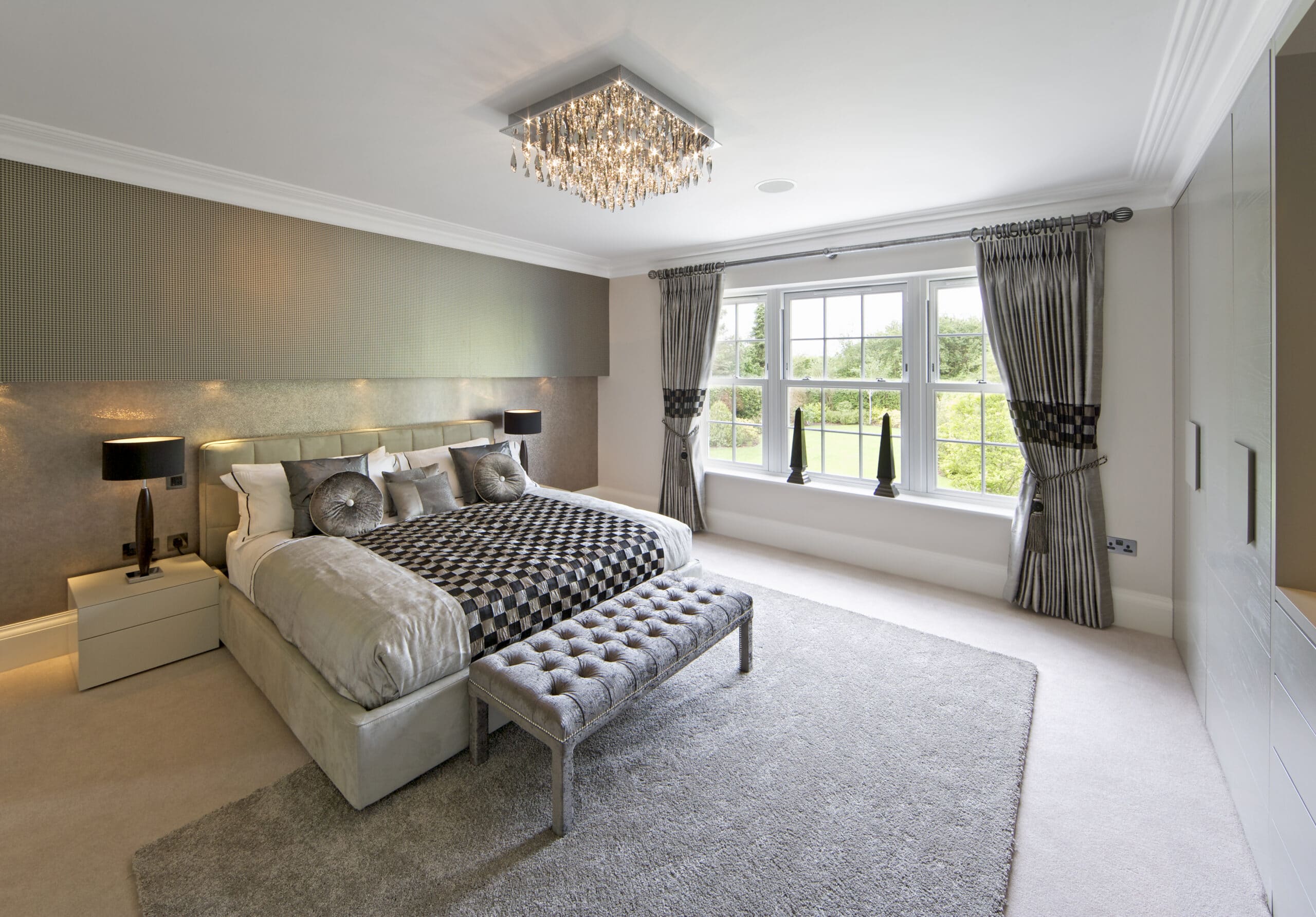 White sliding sash windows in luxury bedroom