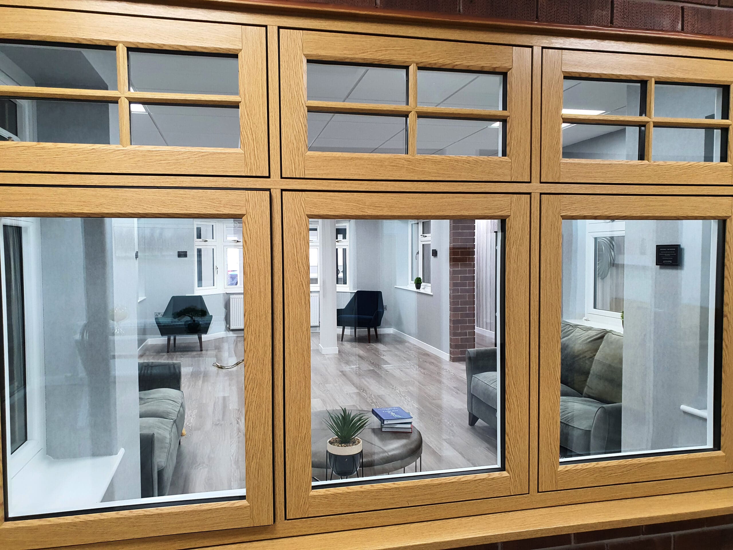View of the Alexander Windows showroom through a flush casement window by The Residence Collection