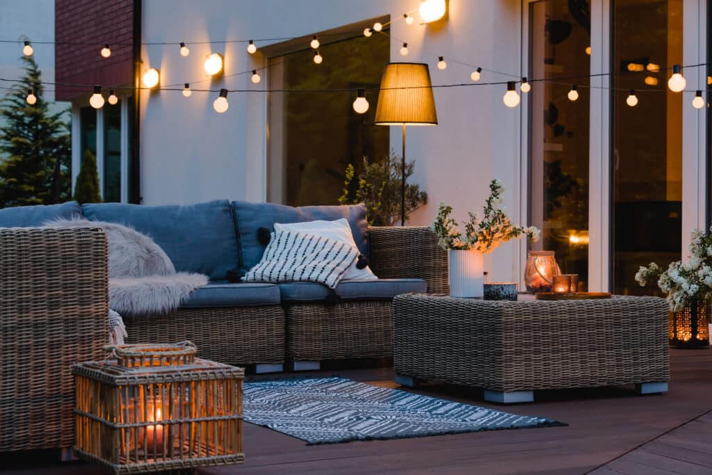Patio with stylish decor and lighting in the evening