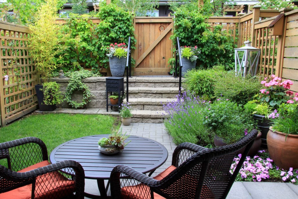 Patio with small table and chairs in garden