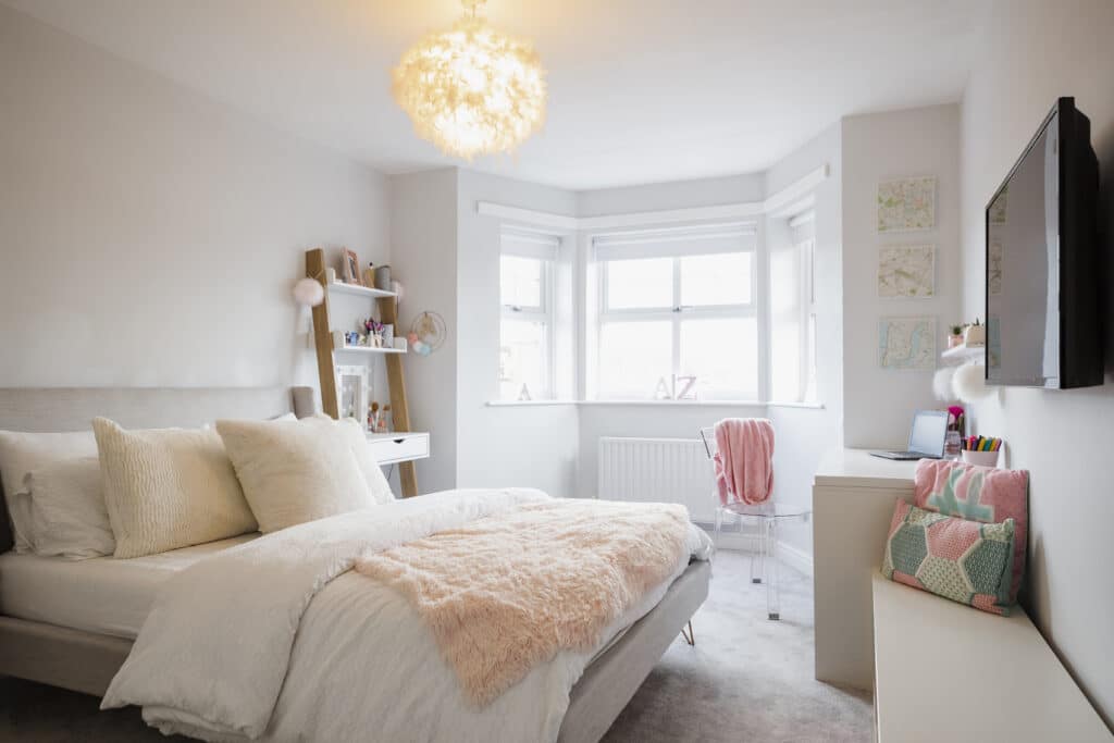 Bright girl's bedroom with white uPVC bay window