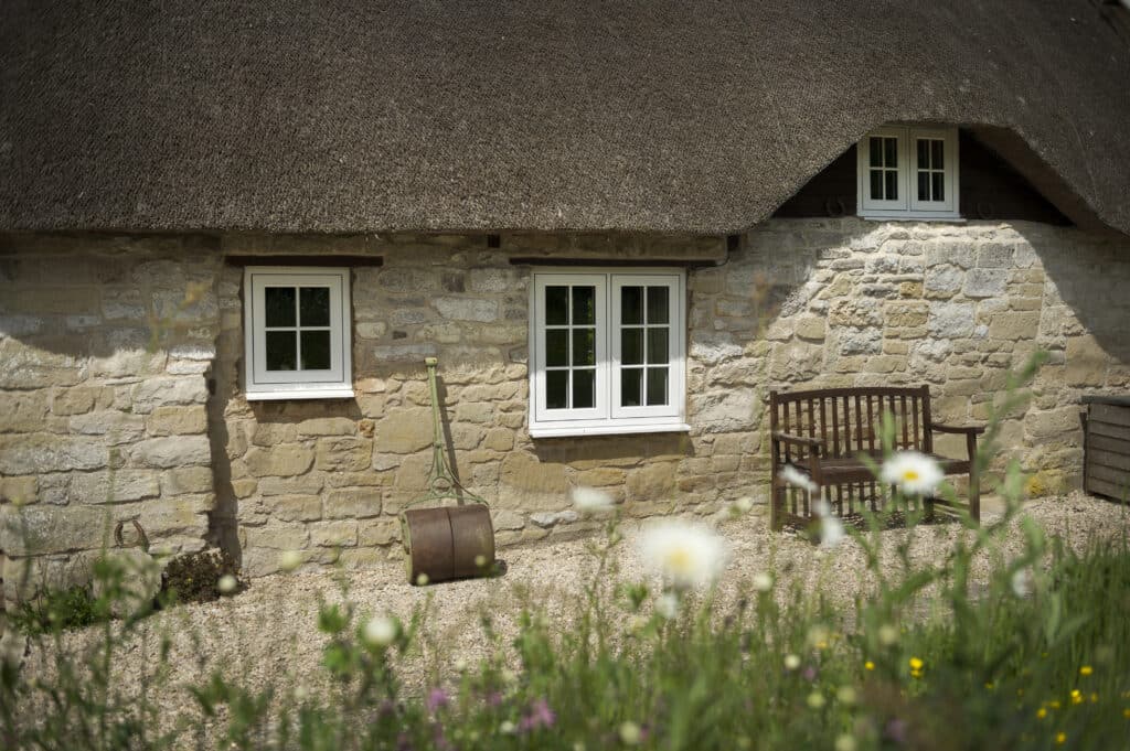 residence collection windows on a stone cottage